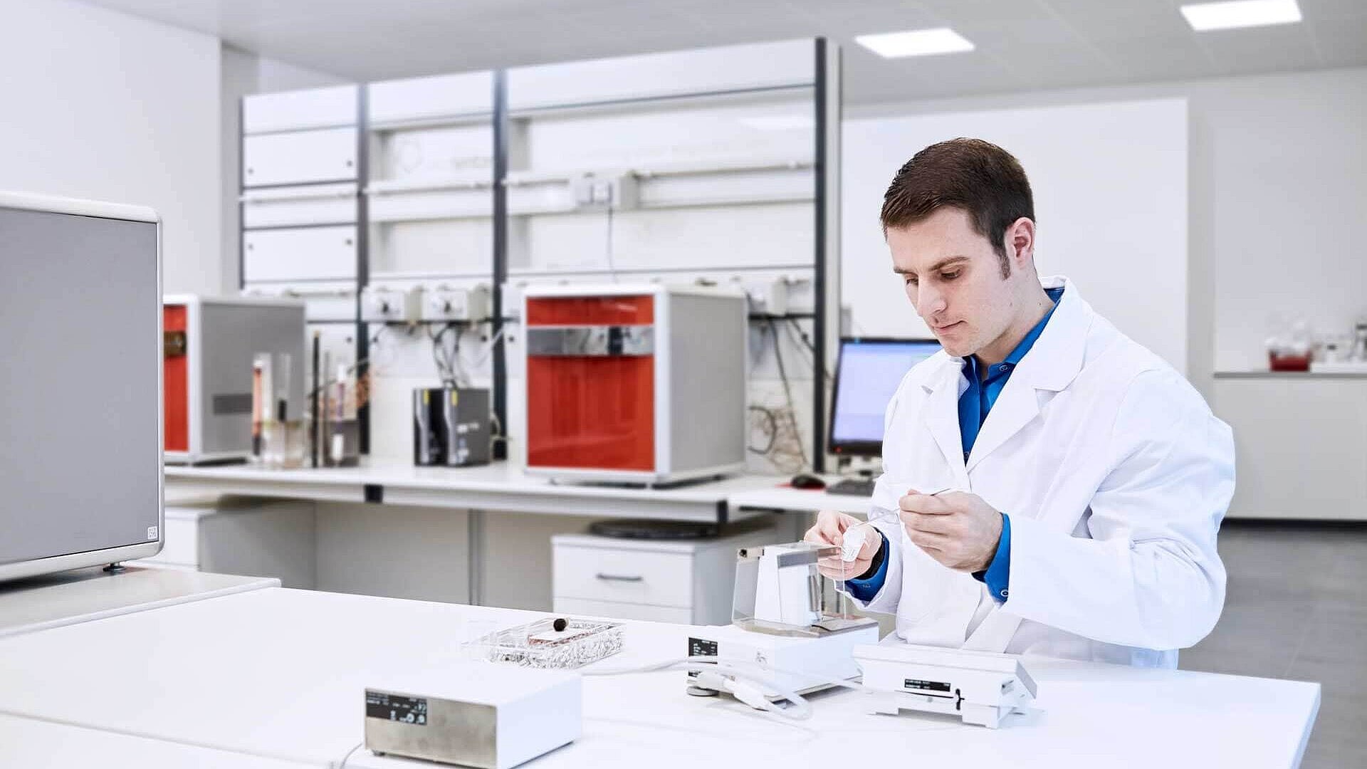 Laboratory technician weighing samples