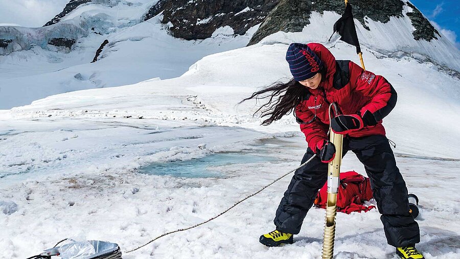 Woman that is drilling an ice core
