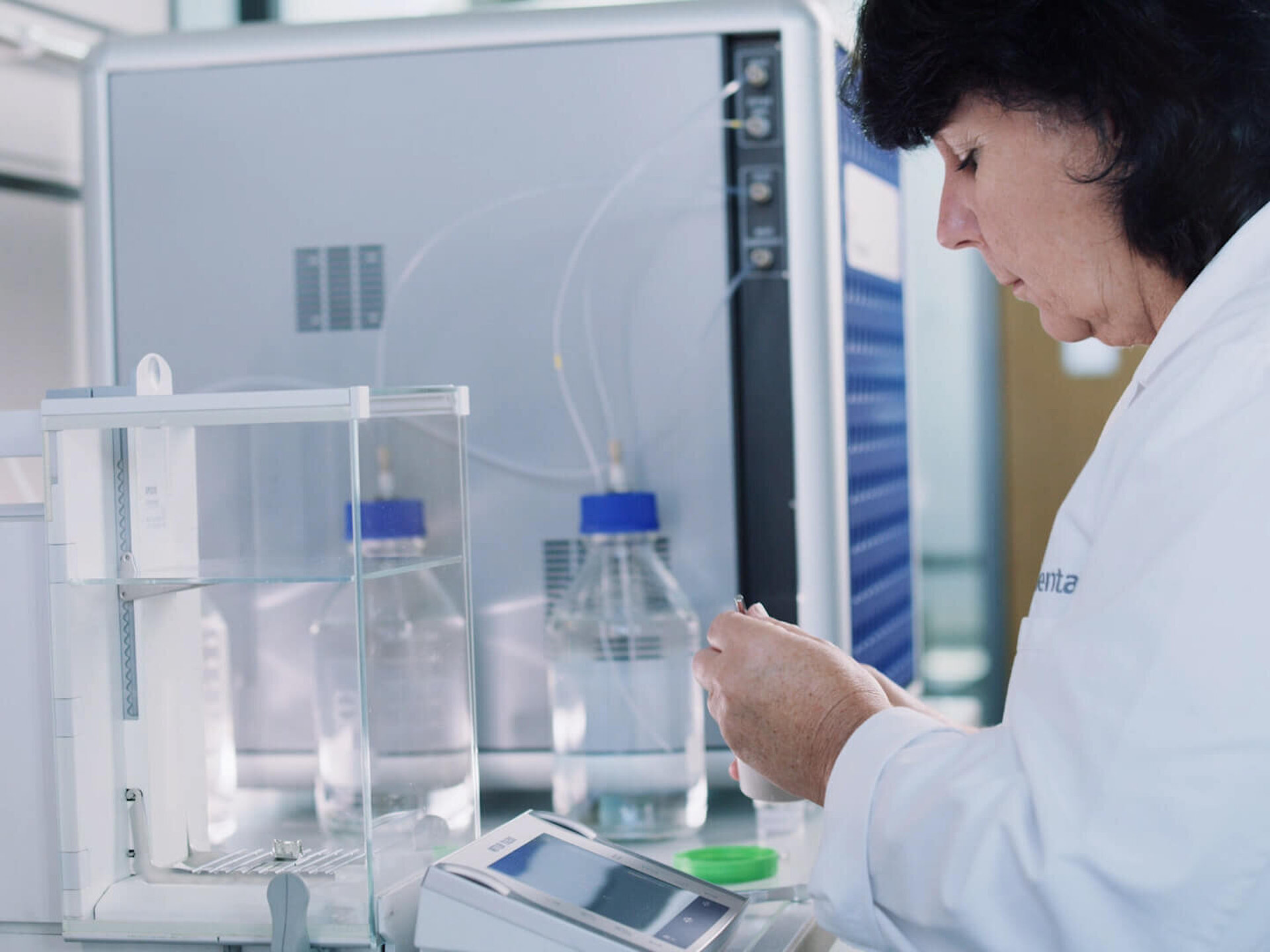 Woman weighing samples in a laboratory