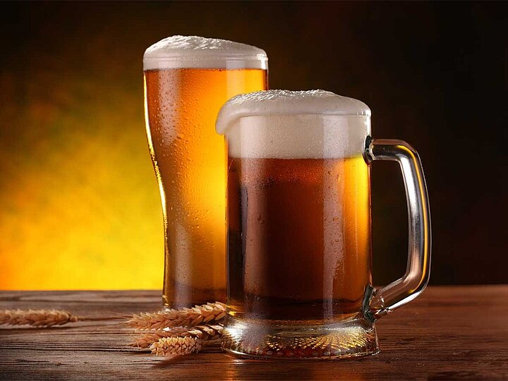 2 beer mugs with beer