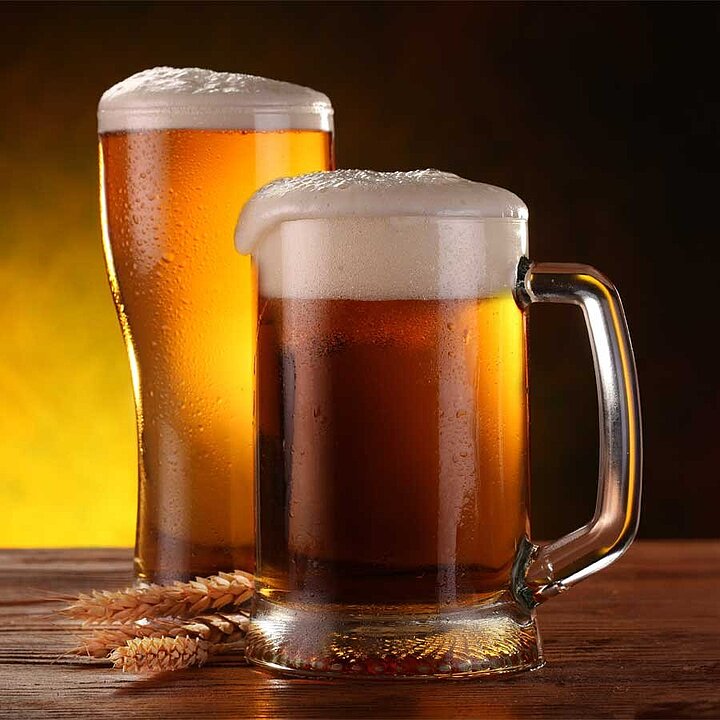 2 beer mugs with beer