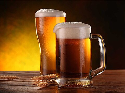 2 beer mugs with beer