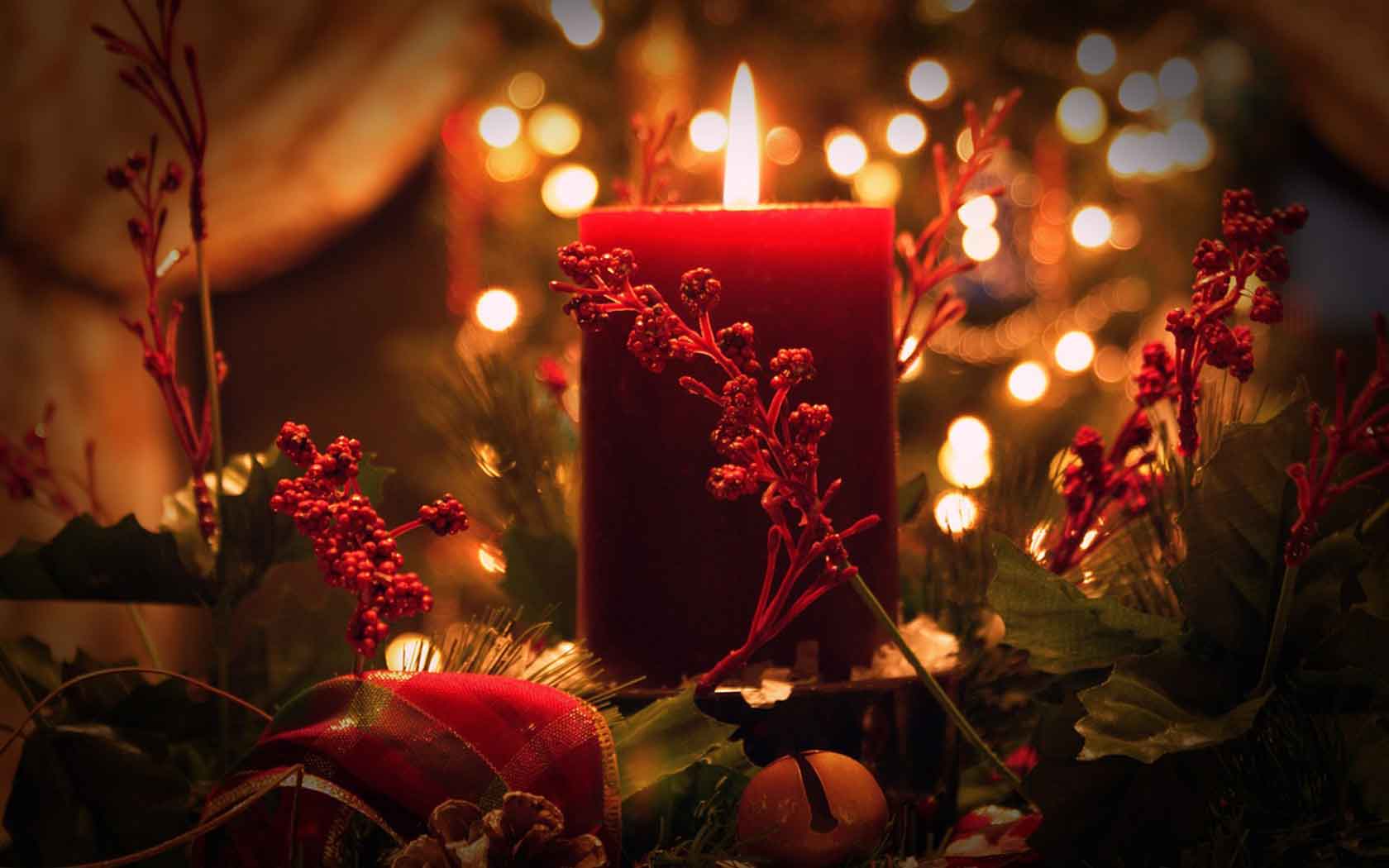 Red candle and Christmas decoration and lights