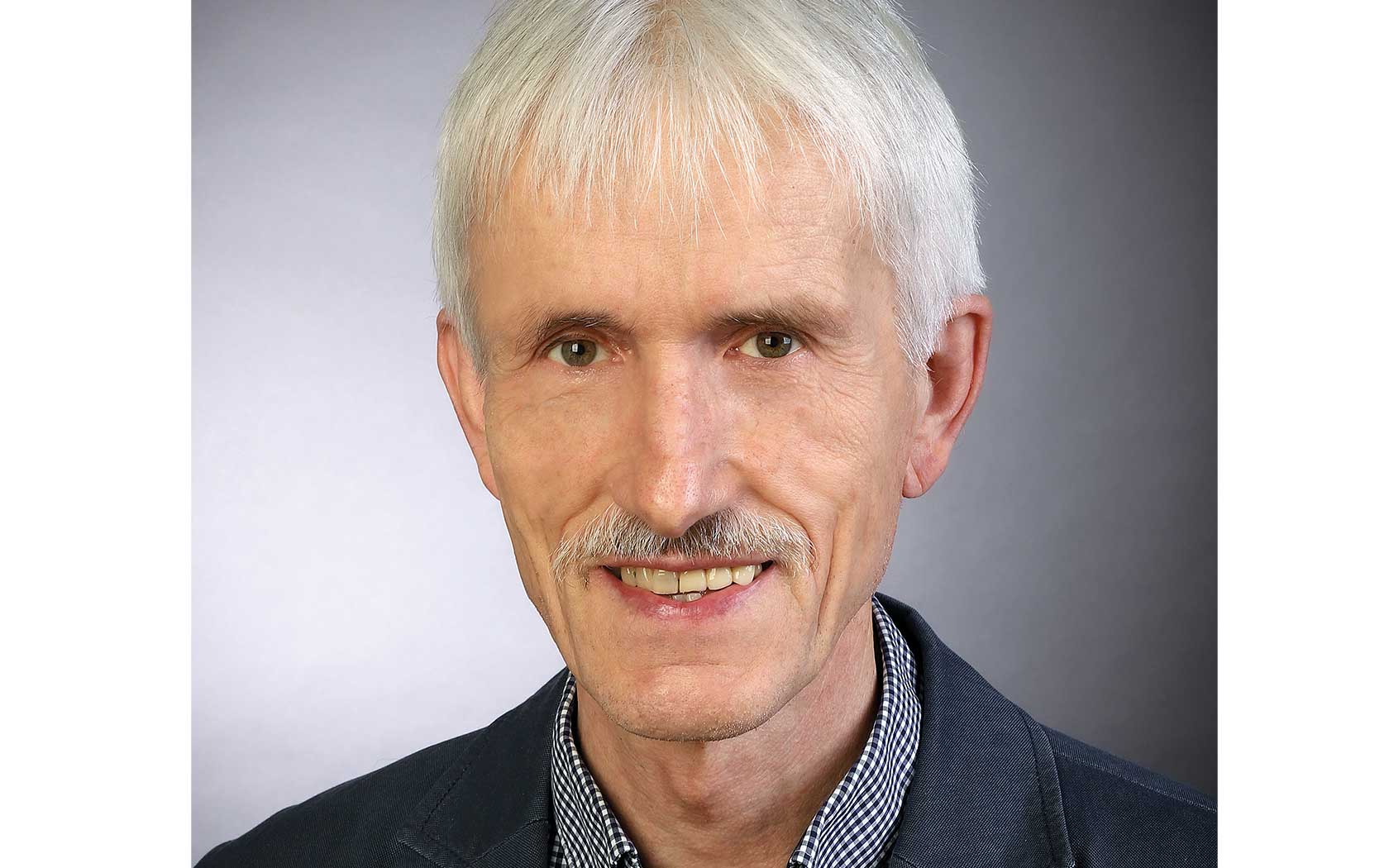 Professor Honermeier on grey background