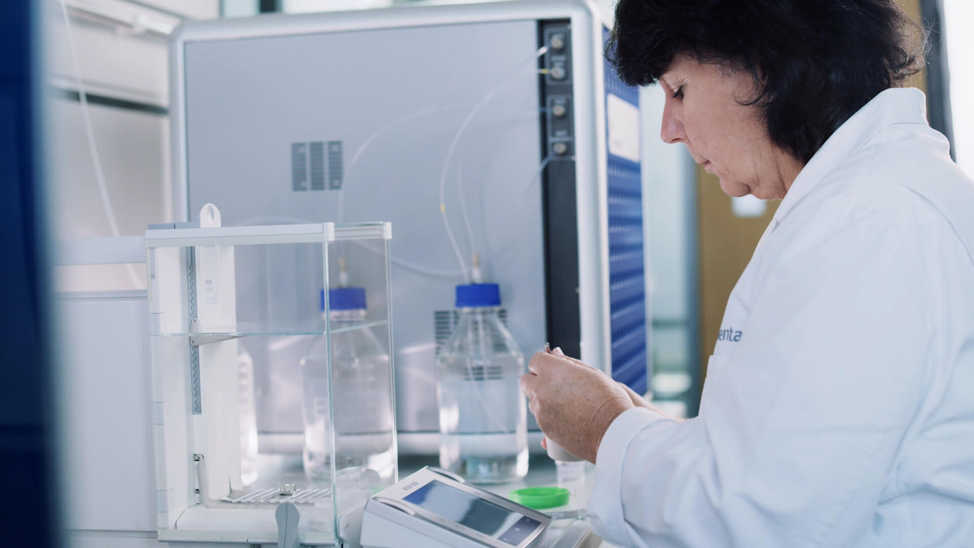 Woman weighing samples in a laboratory